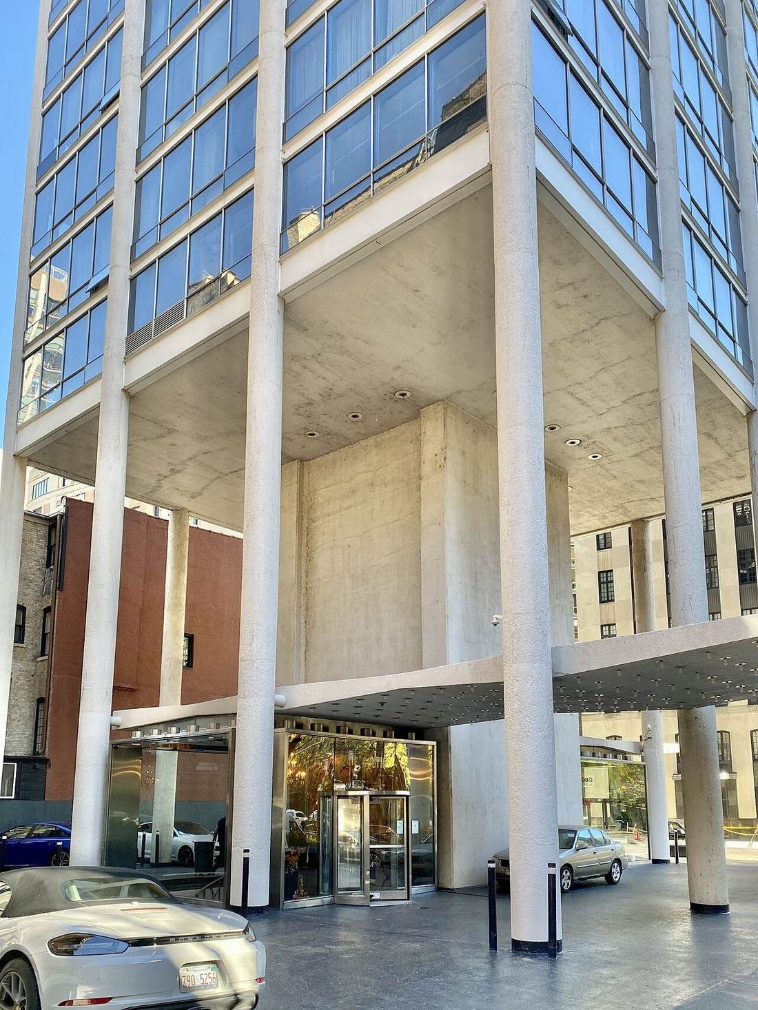Modern glass-fronted residential tower entrance
